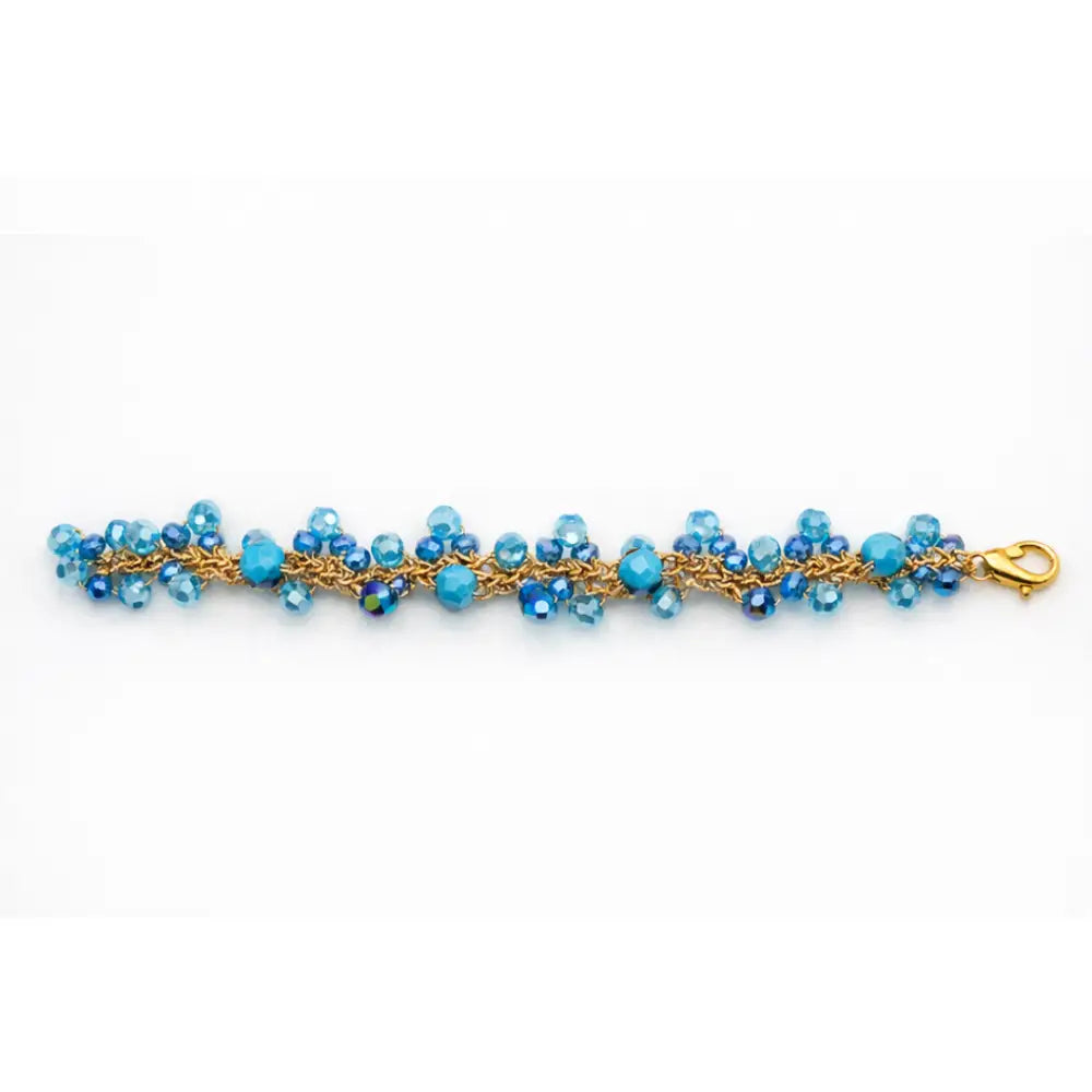 Bracciale handmade Marea in cristalli sfaccettati azzurro oceano con catena dorata