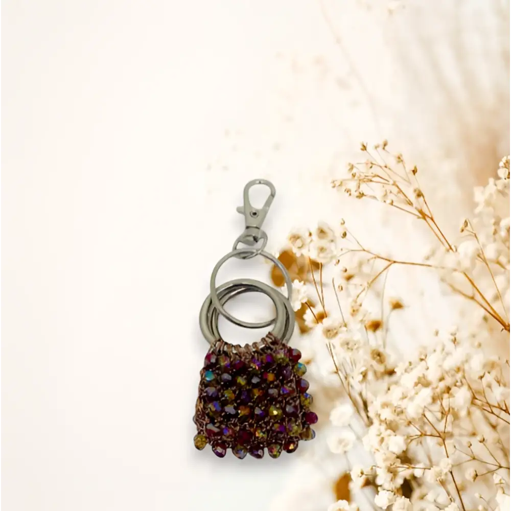 Portachiavi handmade Pochette di Luce con cristalli sfaccettati viola e oro